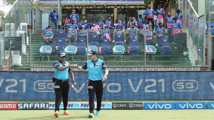 The umpires take to the field during match 28 of the Vivo
