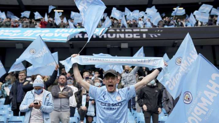 Fans celebrate the start of the English Premier League