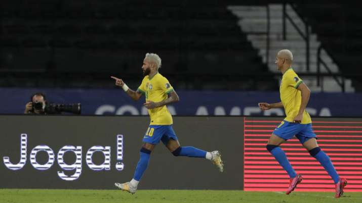 Brazil's Neymar, left, celebrates after scoring his side's