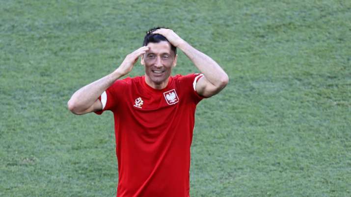 Poland's Robert Lewandowski smiles during training session