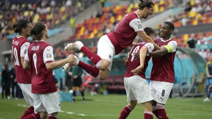 Austria's Christoph Baumgartner (9) celebrates after