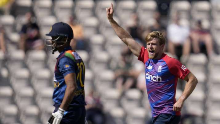 England's David Willey, right, celebrates taking a wicket