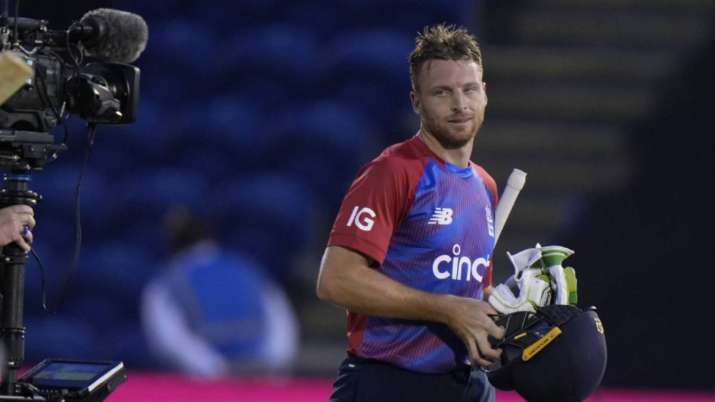 England's Jos Buttler smiles as he walks off the pitch