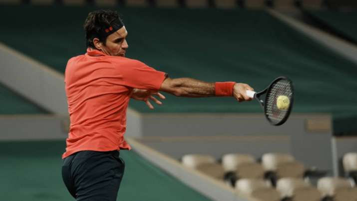 Switzerland's Roger Federer plays a return to Germany's