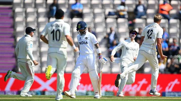 Virat Kohli of India walks off as Kyle Jamieson of New