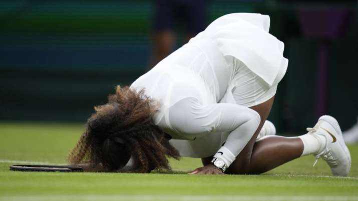 Serena Williams of the US falls to the ground during the