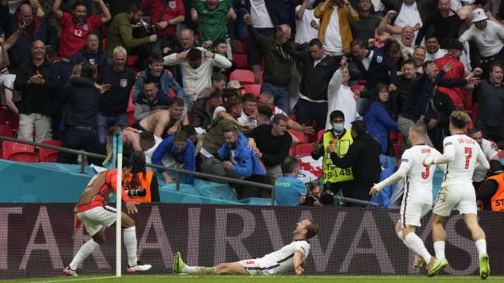 England's Harry Kane, center, celebrates after scoring his