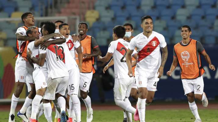 Peru's players celebrate defeating Paraguay 4-3 in a