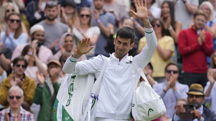 Serbia's Novak Djokovic waves to the crowd as he leaves the