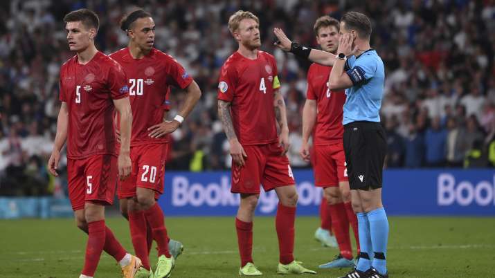 Referee Danny Makkelie checks with VAR for penalty during
