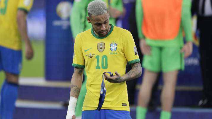 Brazil's Neymar holds the second place medal during the