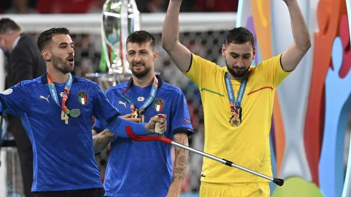 Italy's goalkeeper Gianluigi Donnarumma and his teammate