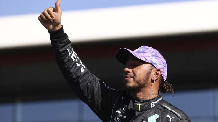 Mercedes driver Lewis Hamilton of Britain gives a thumbs up