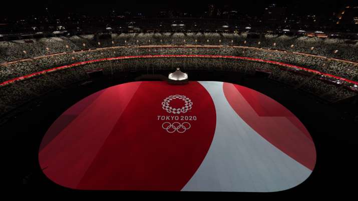 The floor of Olympic Stadium is lit before the start of the