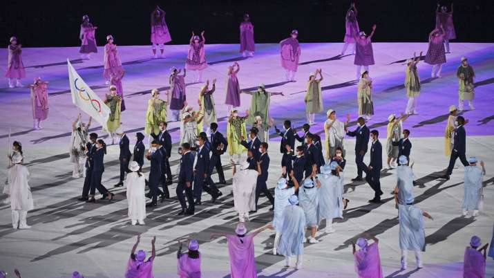 The refugee team carry the Olympic flag during the opening
