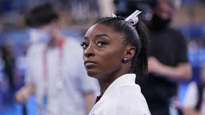 Simone Biles, of the United States, waits for her turn to
