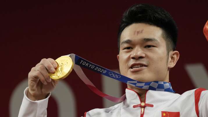 Shi Zhiyong of China celebrates on the podium after winning