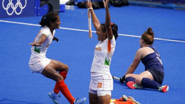 India forward Vandana Kataria ran to the left to hug Rani Rampal