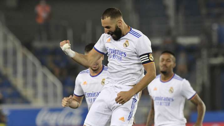 Real Madrid's Karim Benzema celebrates after scoring his