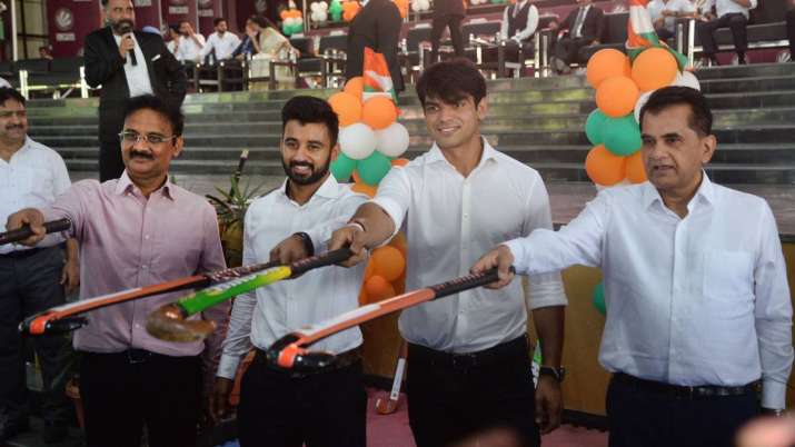 Neeraj Chopra plays hockey with members of Indian men's team