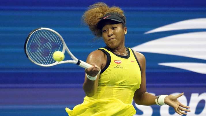 Naomi Osaka, of Japan, returns a shot to Marie Bouzkova, of