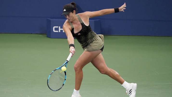 Garbine Muguruza, of Spain, returns a shot to Andrea