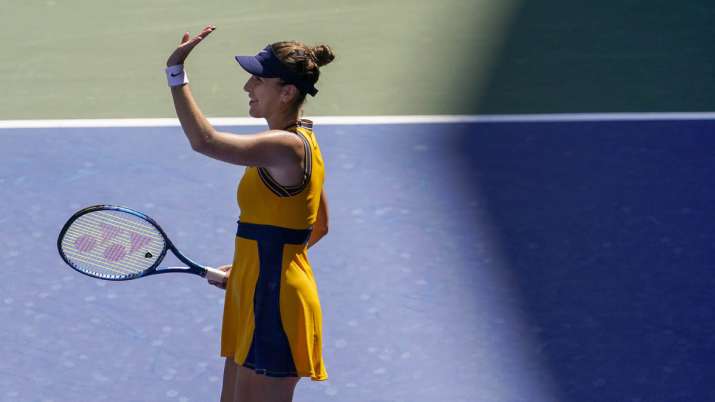 Switzerland's Belinda Bencic reacts by beating