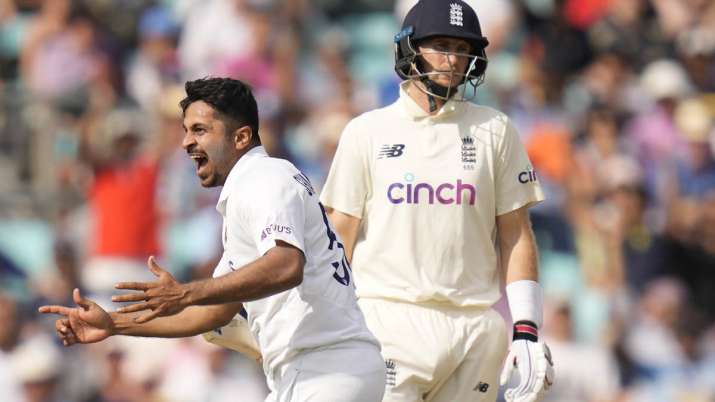 India's Shardul Thakur celebrates taking the wicket of