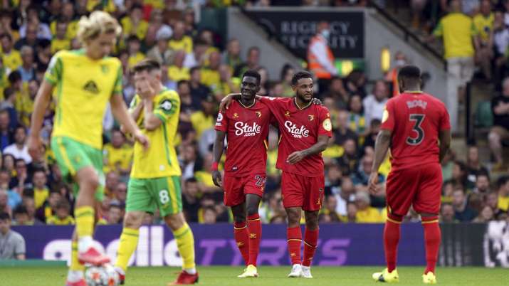 Watford's Ismaila Sarr, center left, celebrates scoring
