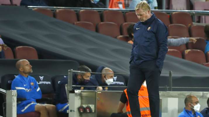Barcelona's head coach Ronald Koeman looks down during the