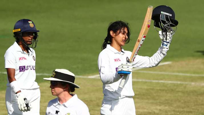 Smriti Mandhana of India celebrates a century during day