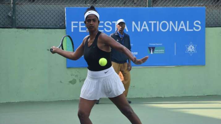 Sharmada Balu prepares to hit a forehand during the Fenesta Open National tennis championship.