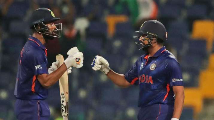 India's KL Rahul, left, and India's Rohit Sharma celebrate scoring runs during Cricket Twenty20 