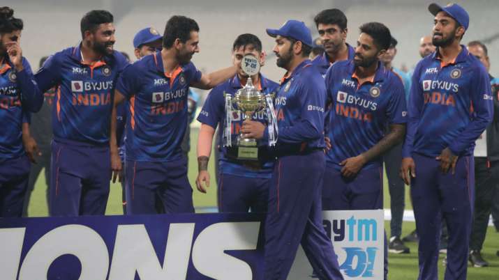 India's captain Rohit Sharma walks with the winners' trophy in Kolkata's Eden Gardens on Sunday.
