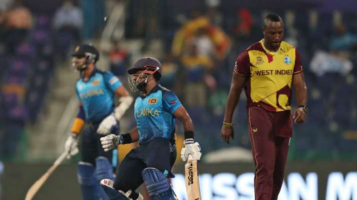 Sri Lanka's Charith Asalanka reacts after he is dismissed by West Indies' Andre Russell, right, duri