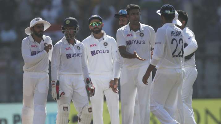 Indian players celebrate after DRS review returned in their favour against New Zealand in Mumbai on 