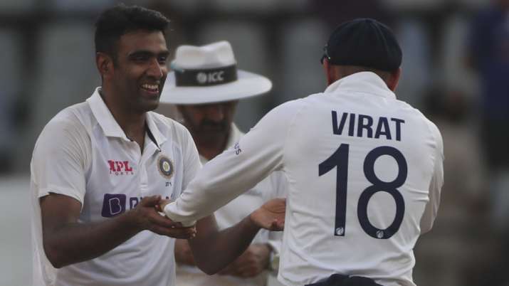 India's Ravichandran Ashwin (left) share a light moment with Virat Kohli during day three of the se