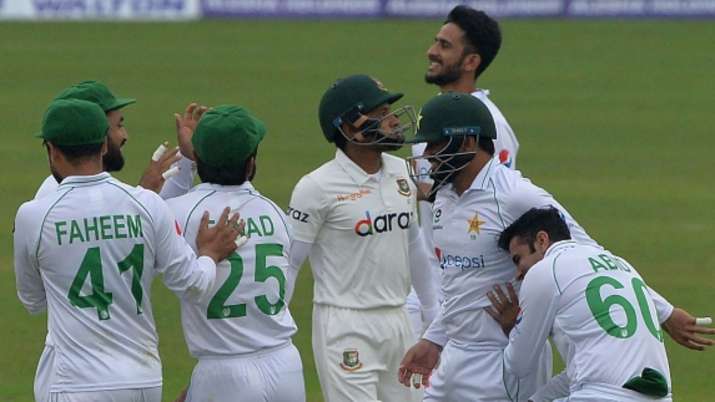 Pakistan's cricketers celebrates after the dismissal of Bangladesh's Mushfiqur Rahim (centre) during