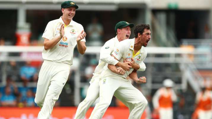Australia pacer Mitchell Starc (far right) celebrates with