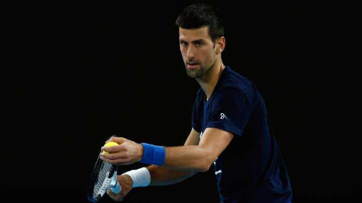 Novak Djokovic of Serbia serves during a practice session ahead of the 2022 Australian Open.