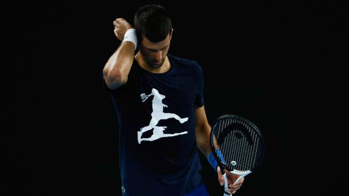 Novak Djokovic of Serbia reacts during a practice session ahead of the 2022 Australian Open.