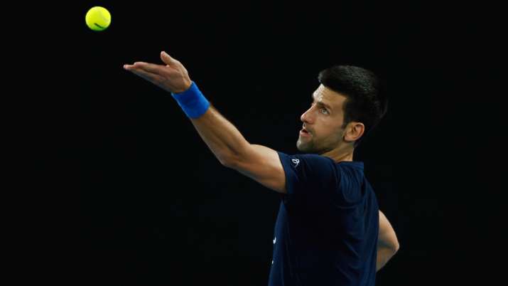 Novak Djokovic of Serbia serves during a practice session ahead of the 2022 Australian Open.