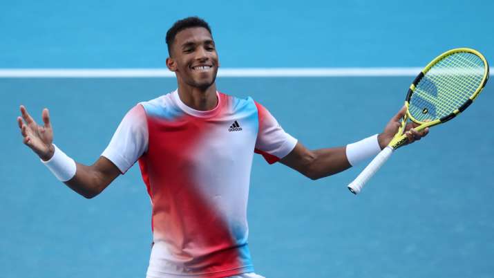 Felix Auger-Aliassime celebrates a match point win in his fourth-round Australian Open match against